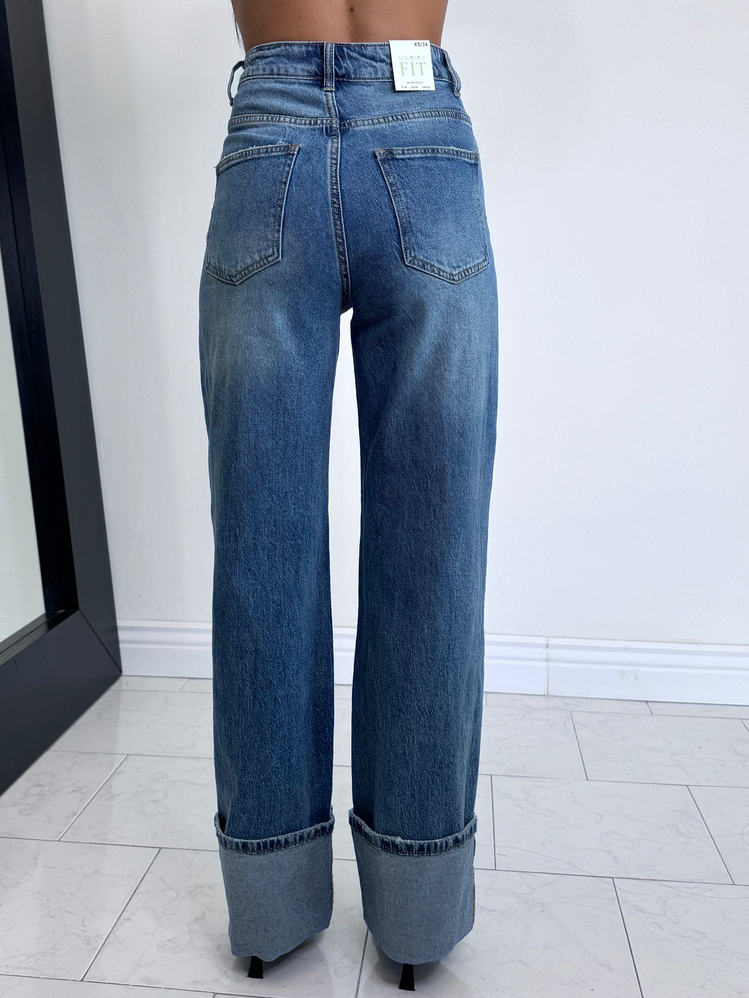 Jeans tendenza con piegone