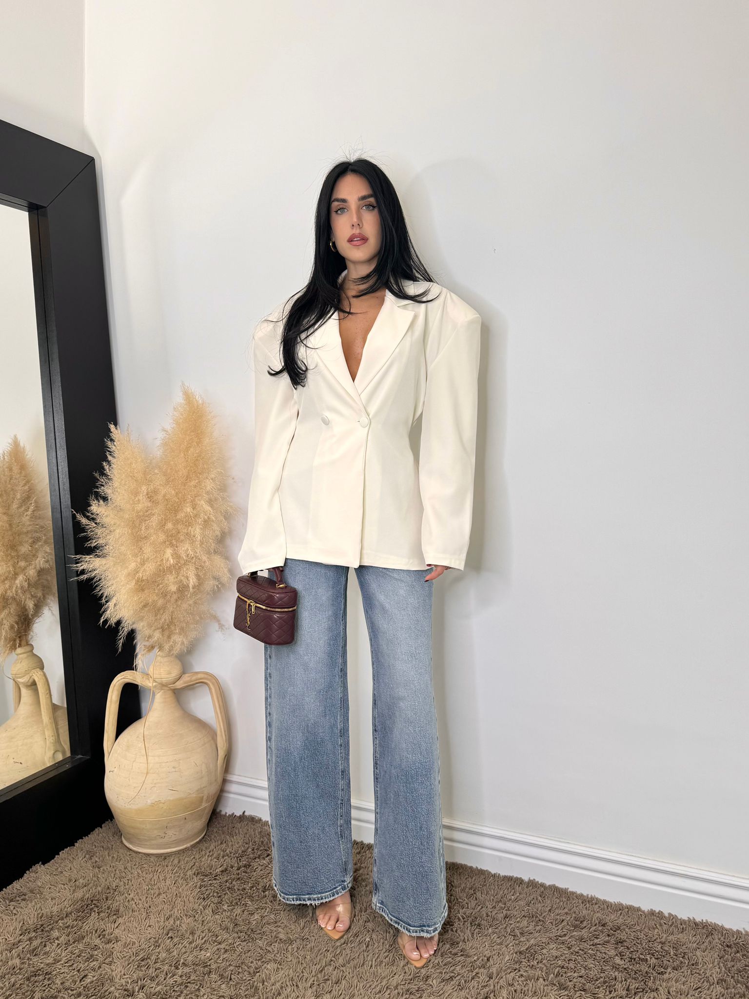 Jeans bottone asimmetrico